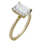 This distinctive bridal set design features a double-layer wedding band that fits around the engagement ring. The set contains .77 ctw of white diamonds.