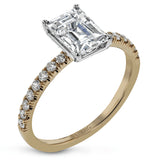 This distinctive bridal set design features a double-layer wedding band that fits around the engagement ring. The set contains .77 ctw of white diamonds.