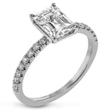 This distinctive bridal set design features a double-layer wedding band that fits around the engagement ring. The set contains .77 ctw of white diamonds.