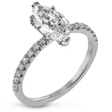 This distinctive bridal set design features a double-layer wedding band that fits around the engagement ring. The set contains .77 ctw of white diamonds.