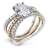 This distinctive bridal set design features a double-layer wedding band that fits around the engagement ring. The set contains .77 ctw of white diamonds.