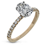 This distinctive bridal set design features a double-layer wedding band that fits around the engagement ring. The set contains .77 ctw of white diamonds.