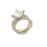 This distinctive bridal set design features a double-layer wedding band that fits around the engagement ring. The set contains .77 ctw of white diamonds.