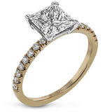 This distinctive bridal set design features a double-layer wedding band that fits around the engagement ring. The set contains .77 ctw of white diamonds.