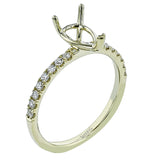 This distinctive bridal set design features a double-layer wedding band that fits around the engagement ring. The set contains .77 ctw of white diamonds.