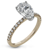 This distinctive bridal set design features a double-layer wedding band that fits around the engagement ring. The set contains .77 ctw of white diamonds.