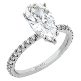 This distinctive bridal set design features a double-layer wedding band that fits around the engagement ring. The set contains .77 ctw of white diamonds.
