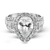 This gorgeous engagement ring makes quite the appearance with .83 ctw of round diamonds along with .83 ctw of baguette diamonds.