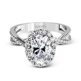 This sparkling modern engagement ring features an eye-catching twisted design with elegant classic halo accented by .29 ctw of shimmering round cut white diamonds.