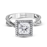 This sparkling modern engagement ring features an eye-catching twisted design with elegant classic halo accented by .29 ctw of shimmering round cut white diamonds.