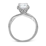 This sparkling modern engagement ring features an eye-catching twisted design with elegant classic halo accented by .29 ctw of shimmering round cut white diamonds.