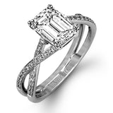 This sparkling modern white gold engagement ring and wedding band set features an eye-catching twisted design accented by .22 ctw of shimmering round cut white diamonds.