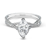 This sparkling modern white gold engagement ring and wedding band set features an eye-catching twisted design accented by .22 ctw of shimmering round cut white diamonds.