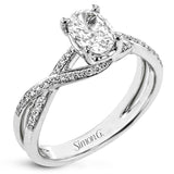 This sparkling modern white gold engagement ring and wedding band set features an eye-catching twisted design accented by .22 ctw of shimmering round cut white diamonds.