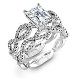 The intricate twisted design of this modern white gold engagement ring and wedding band set is set with .65 ctw of striking round cut white diamonds.