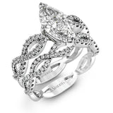 The intricate twisted design of this modern white gold engagement ring and wedding band set is set with .65 ctw of striking round cut white diamonds.