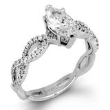 The intricate twisted design of this modern white gold engagement ring and wedding band set is set with .65 ctw of striking round cut white diamonds.