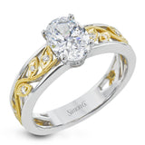 A delicate floral design highlights this vintage style engagement ring accented by .09 ctw of shimmering round cut white diamonds.