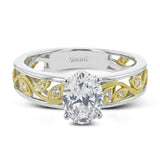 A delicate floral design highlights this vintage style engagement ring accented by .09 ctw of shimmering round cut white diamonds.