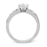 A delicate floral design highlights this vintage style engagement ring accented by .09 ctw of shimmering round cut white diamonds.