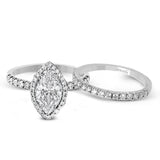 This elegant classic white gold halo engagement ring and band is set with .78 ctw of sparkling round cut white diamonds.