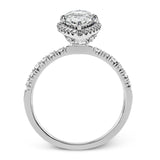 This elegant classic white gold halo engagement ring and band is set with .78 ctw of sparkling round cut white diamonds.