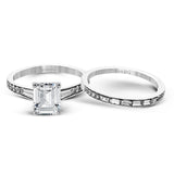 This dazzling white gold wedding set is enhanced by .21 ctw round cut white diamonds with side accents of .53 ctw of baguette cut diamonds.