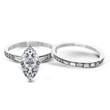 This dazzling white gold wedding set is enhanced by .21 ctw round cut white diamonds with side accents of .53 ctw of baguette cut diamonds.