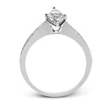 This dazzling white gold wedding set is enhanced by .21 ctw round cut white diamonds with side accents of .53 ctw of baguette cut diamonds.