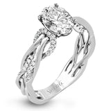 This impressive contemporary white engagement ring features a unique twisting design on the shank, which is complemented by .17 ctw of round cut white diamonds.