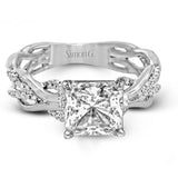 This impressive contemporary white engagement ring features a unique twisting design on the shank, which is complemented by .17 ctw of round cut white diamonds.