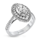 This 18k white gold engagement ring setting has a stunning double halo design set with .61 ctw of shining white round brilliant diamonds.
