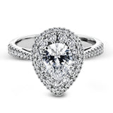 This 18k white gold engagement ring setting has a stunning double halo design set with .61 ctw of shining white round brilliant diamonds.