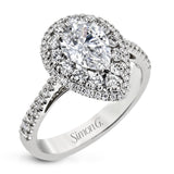 This 18k white gold engagement ring setting has a stunning double halo design set with .61 ctw of shining white round brilliant diamonds.