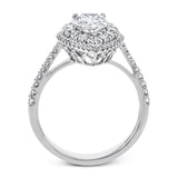 This 18k white gold engagement ring setting has a stunning double halo design set with .61 ctw of shining white round brilliant diamonds.