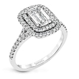 This beautiful, classic style setting features a double halo design built for an oval center stone. It contains .40 ctw of side diamonds.