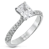 The classic design of this white gold engagement ring and wedding band set is emphasized by .72 ctw round cut white diamonds.