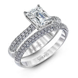 The classic design of this white gold engagement ring and wedding band set is emphasized by .72 ctw round cut white diamonds.