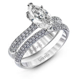 The classic design of this white gold engagement ring and wedding band set is emphasized by .72 ctw round cut white diamonds.