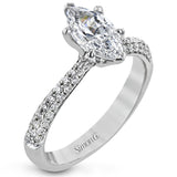 The classic design of this white gold engagement ring and wedding band set is emphasized by .72 ctw round cut white diamonds.