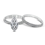 The classic design of this white gold engagement ring and wedding band set is emphasized by .72 ctw round cut white diamonds.