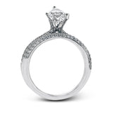 The classic design of this white gold engagement ring and wedding band set is emphasized by .72 ctw round cut white diamonds.