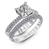The classic design of this white gold engagement ring and wedding band set is emphasized by .72 ctw round cut white diamonds.