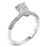 The classic design of this white gold engagement ring and wedding band set is emphasized by .72 ctw round cut white diamonds.