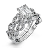 This delicate floral inspired white gold engagement ring and wedding band set is accentuated with .28 ctw shimmering round cut white diamonds.