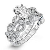 This beautiful vintage-inspired engagement ring design is built for an oval center stone and contains the perfect touches of .28 ctw of white diamonds in its midst.