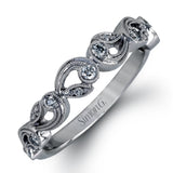 This beautiful vintage-inspired engagement ring design is built for an oval center stone and contains the perfect touches of .28 ctw of white diamonds in its midst.