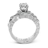 This beautiful vintage-inspired engagement ring design is built for an oval center stone and contains the perfect touches of .28 ctw of white diamonds in its midst.