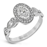 Reflecting a lovely romantic design, this white gold classic engagement ring features .16 ctw round cut white diamond accents.