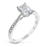 The delicate, understated design of this lovely white gold ring is elevated by .27 ctw of round white diamond accents.